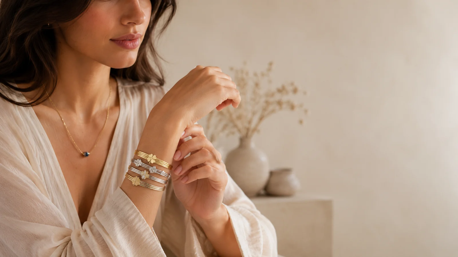 Gold and silver Zeray bangles arranged as an elegant layered wrist stack