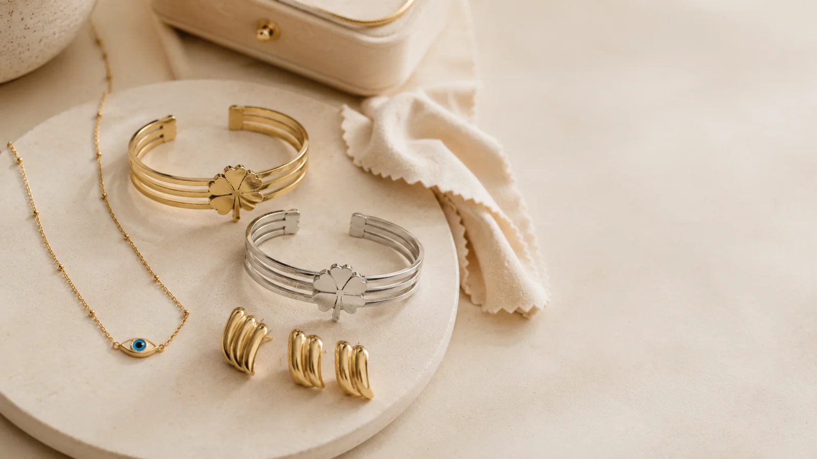 Gold and silver stainless steel jewellery displayed on a clean care station